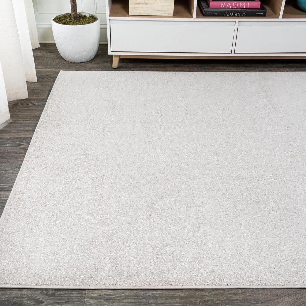 Ivory Low-Pile Washable Synthetic Area Rug, 9 x 12