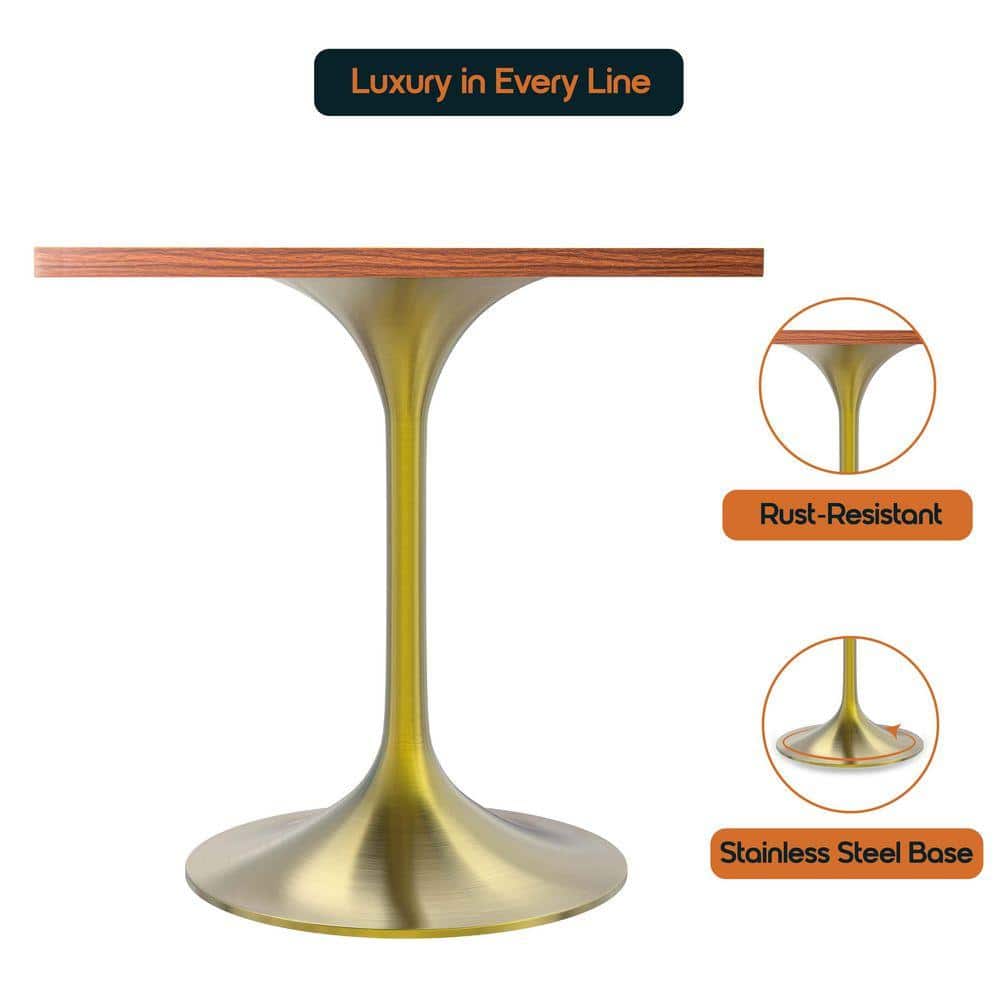Close-up of a square dining table top and gold pedestal base.