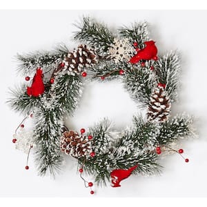 22 in. Artificial Snowy Pine Wreath with Cardinals and Snowflakes on Natural Twig Base