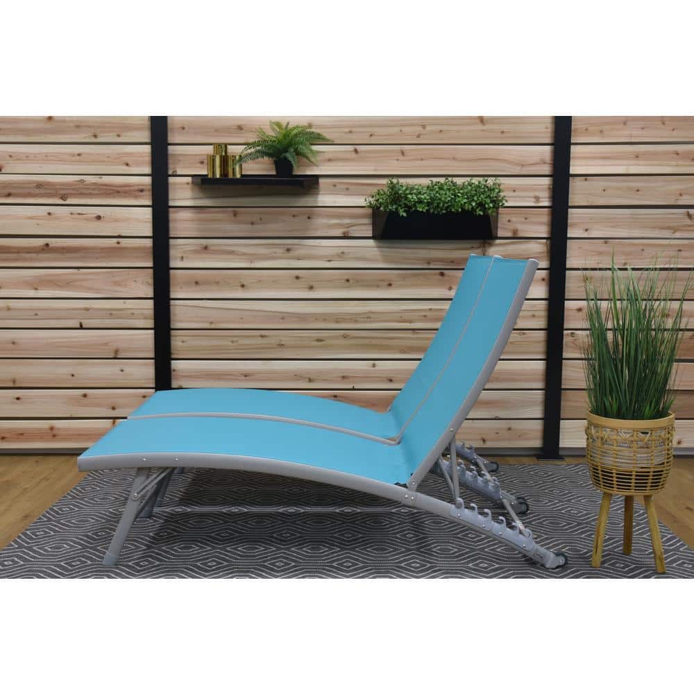 One blue outdoor chaise lounge on a wooden deck.