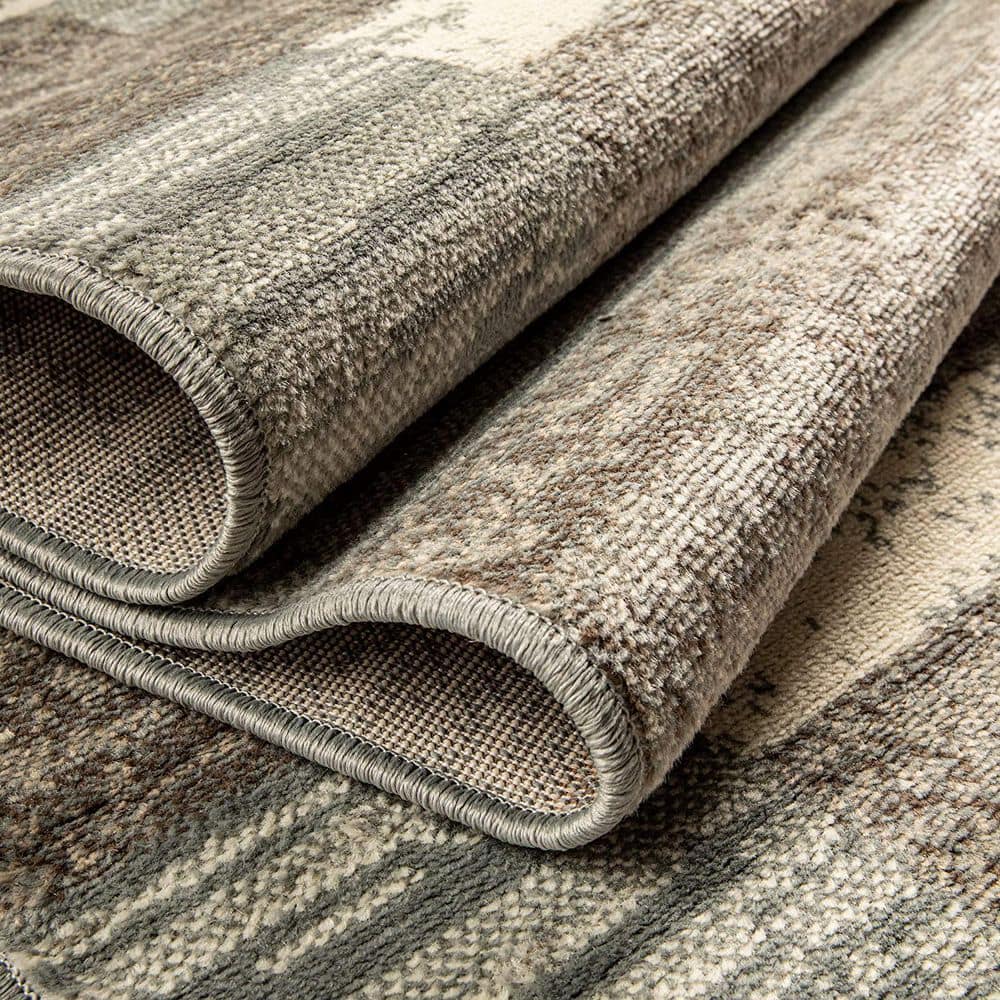 Ivory Geometric Synthetic 5' x 8' Easy-Care Area Rug
