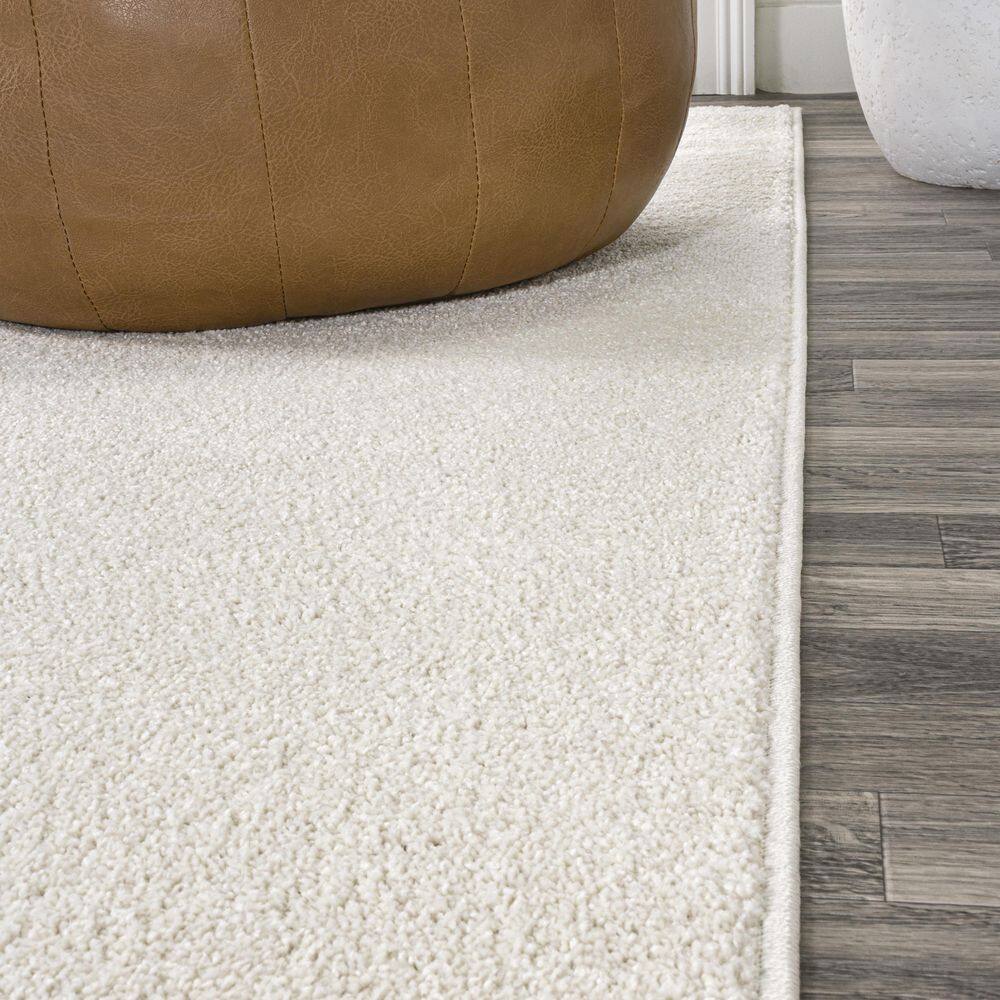 Cream Oval Low-Pile Synthetic Indoor Area Rug