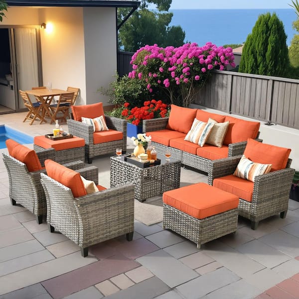 Lotus D 8-Piece Wicker Patio Conversation Seating Set with Coffee Table and Orange Red Cushions