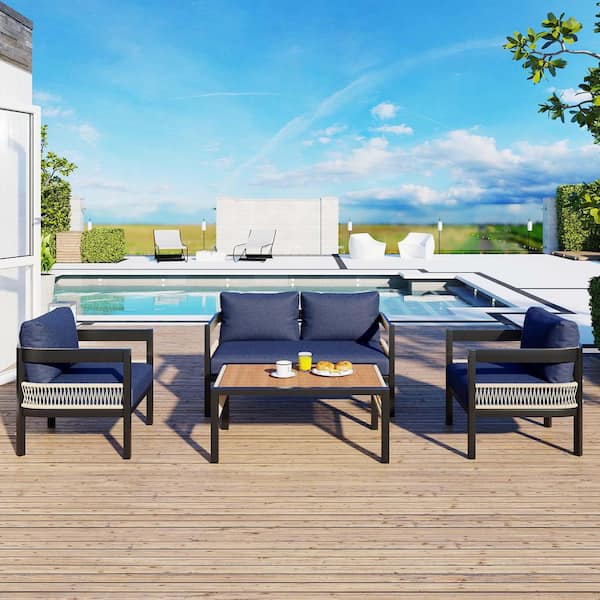 4-Piece Black Iron Outdoor Patio Conversation Set with Dark Blue Cushions, Rattan Decoration and 1 Coffee Table