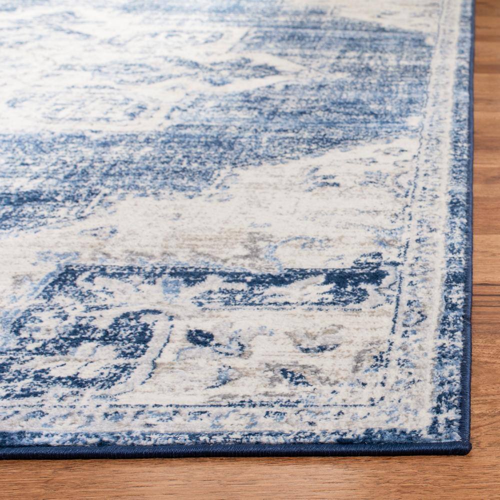 Ivory and Navy Classic Synthetic Round Rug, 6' x 9', Stain-Resistant