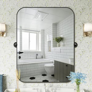 24 in. W x 36 in. H Rectangular Metal Framed Pivoted Bathroom Wall Vanity Mirror in Black