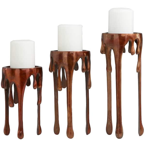 Litton Lane Copper Aluminum Pillar Candle Holder with Dripping Melting Designed Legs (Set of 3)