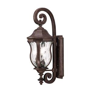 Monticello 10.13 in. W x 28 in. H 3-Light Walnut Patina Outdoor Wall Sconce with Clear Watered Glass