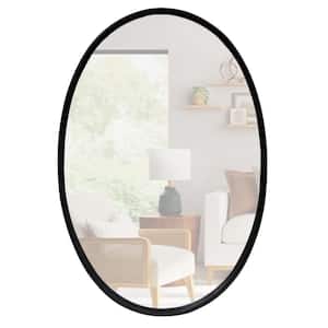 30.98 in. H x 0.79 in. W Black Oval Metal Wall Mirror with Framed Edges and Wooden Backing