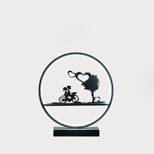 13 in. Matte Black Metal Couples on Bicycle LED Accent Table Lamp