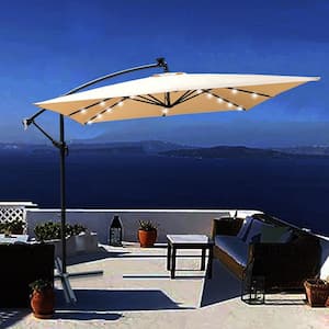 8.2 ft. Square Steel Cantilever Solar Patio Umbrella in Tan Offset Hanging Umbrella with 32 LED Lights and Cross Base