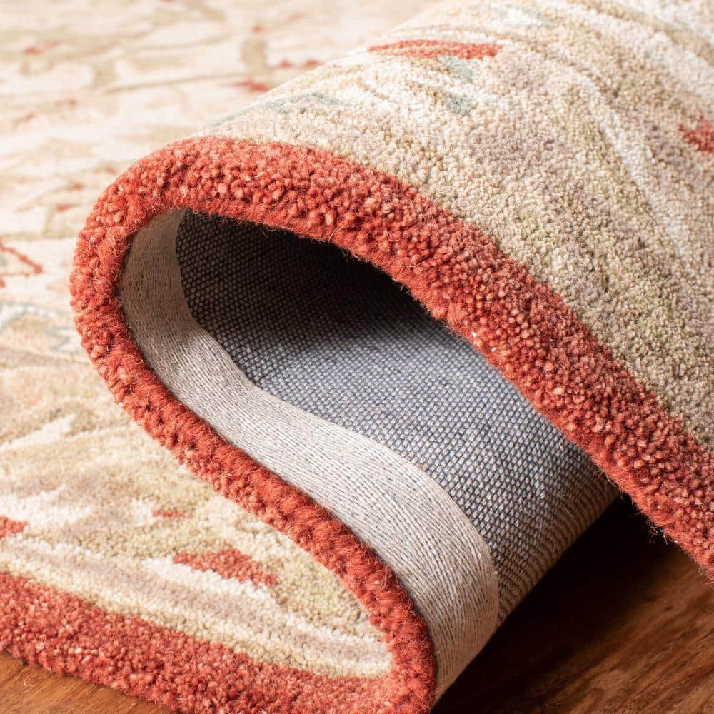 Handmade Beige and Rust Floral Wool Area Rug, 5' x 8'