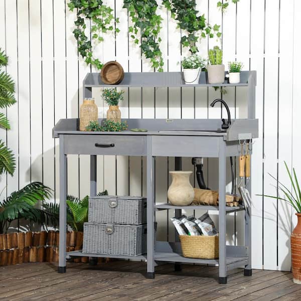 https://images.thdstatic.com/productImages/a812b1fb-46bd-4064-acae-0191e66428e8/svn/gray-outsunny-potting-benches-and-tables-845-543v00gy-31_600.jpg