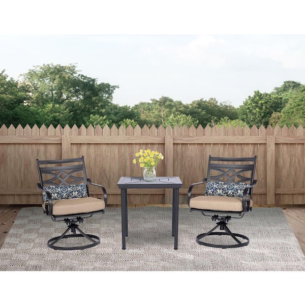 Hanover Montclair 3-Piece Steel Outdoor Bistro Set with Tan Cushions, 2 Swivel Rockers and 27 in. Table