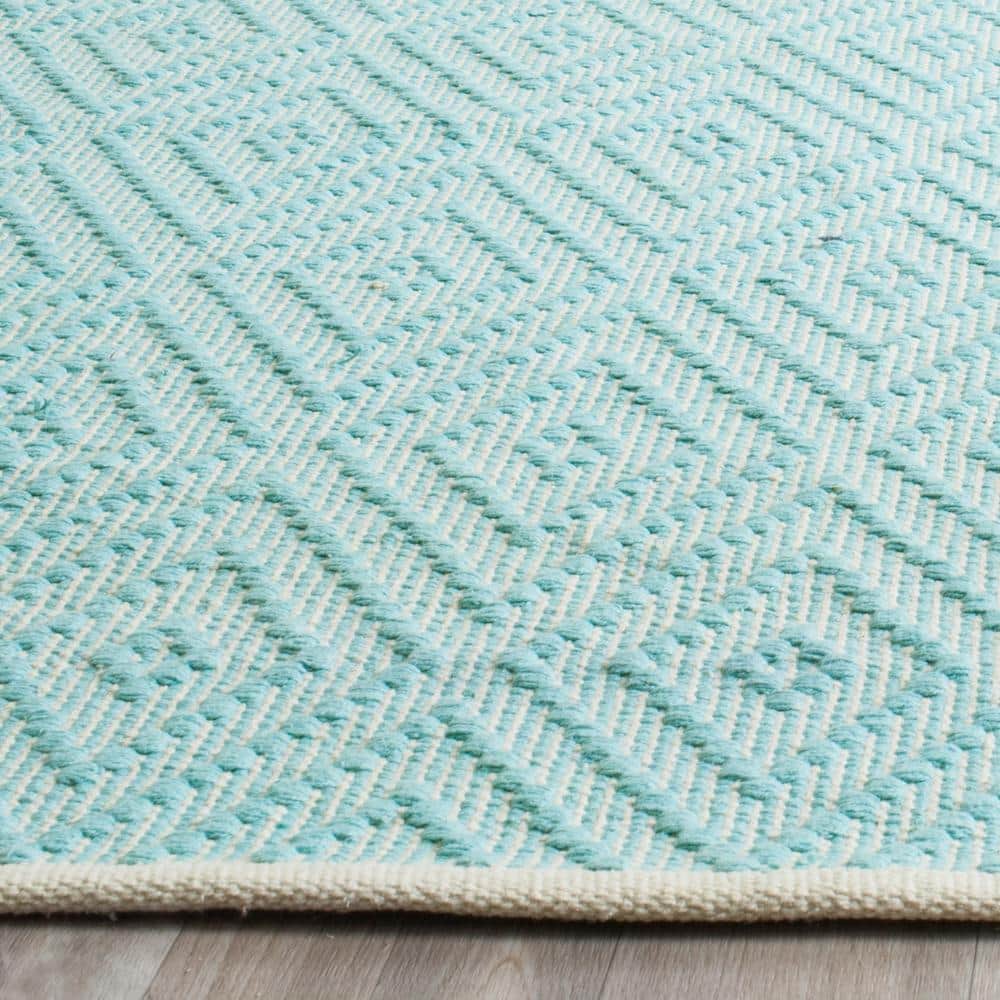 Turquoise and Ivory Cotton 5'x7' Geometric Flat Woven Rug