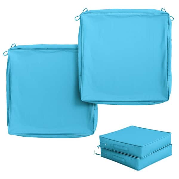 Two blue seat cushion covers folded and stacked