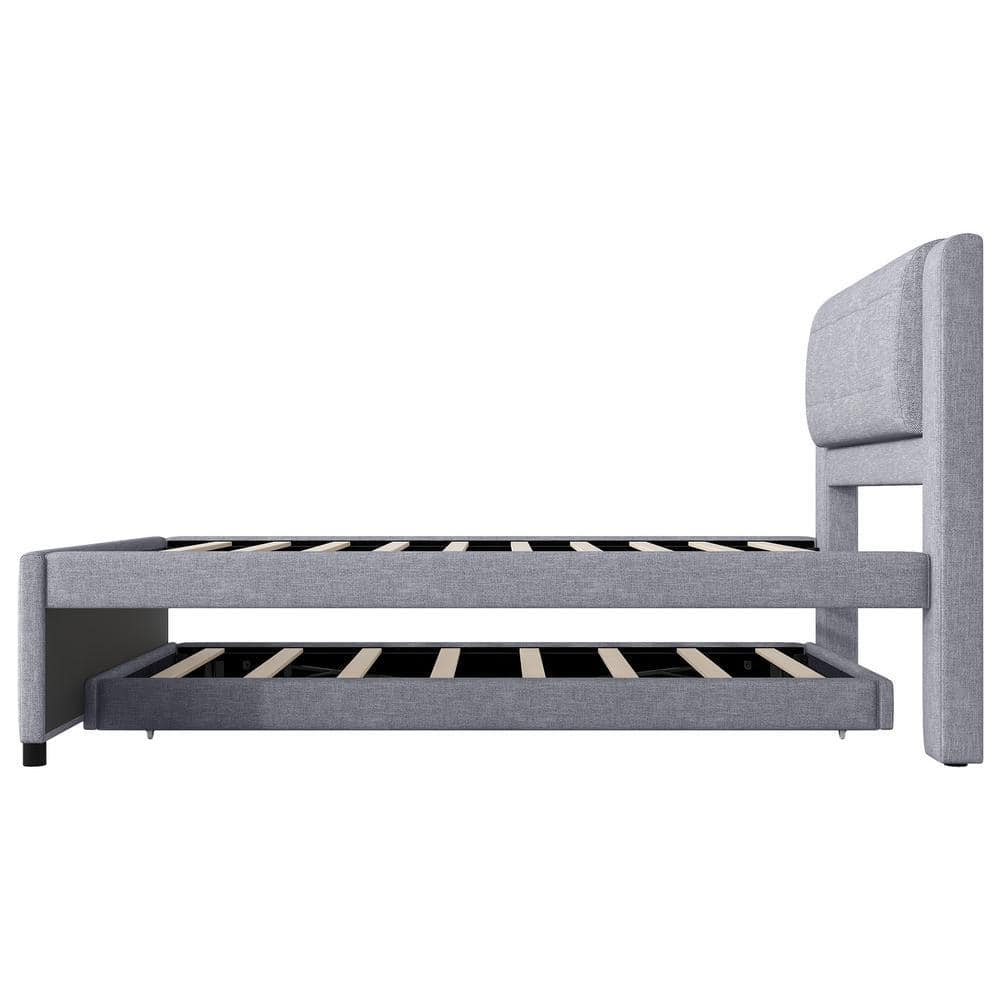 Gray platform bed frame with upholstered headboard.