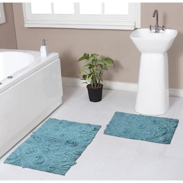 https://images.thdstatic.com/productImages/a8cd503b-54bc-4be2-a847-c32ca6d9a14b/svn/blue-bathroom-rugs-bath-mats-bmo2pc1721blue-64_600.jpg