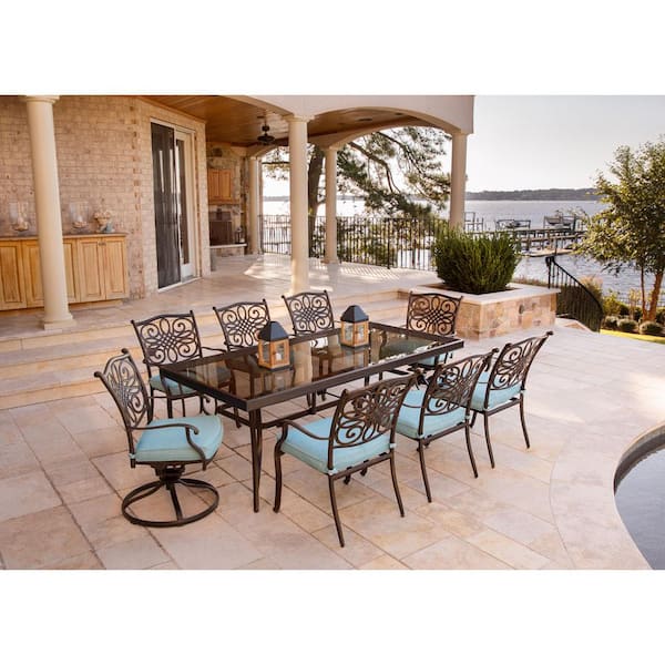 Hanover Traditions 9-Piece Aluminum Outdoor Dining Set with Rectangular Glass Table and 2 Swivel Chairs with Blue Cushions