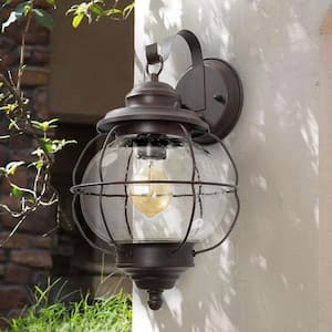 Modern Bronze Outdoor Wall Sconce Coastal Industrial 1-Light 10 in. Coach Light with Cage-Seeded Glass Shade
