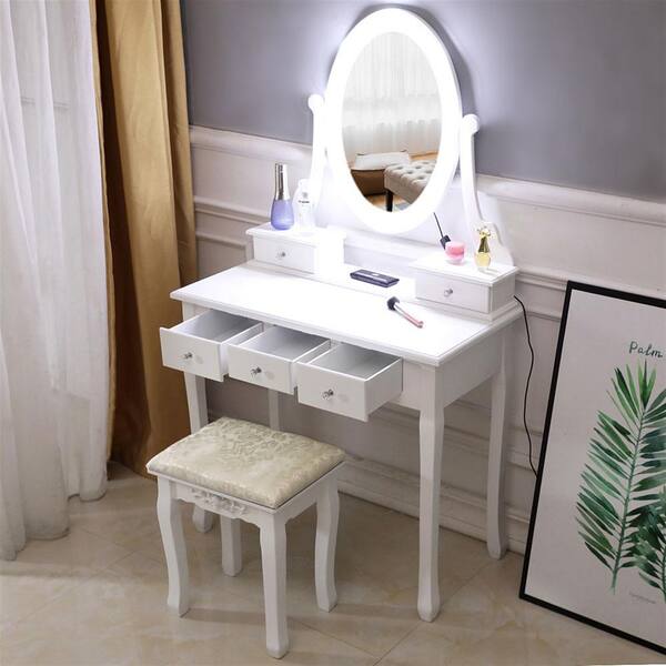 white dressing table with mirror lights and stool