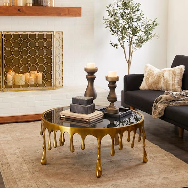 36 in. Gold Medium Round Aluminum Drip Coffee Table with Melting Designed Legs and Shaded Glass Top