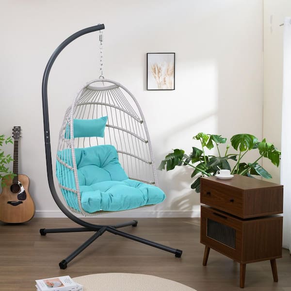 Cesicia 1-Person Wicker Patio Swing with Black Steel Stand and Blue Cushion