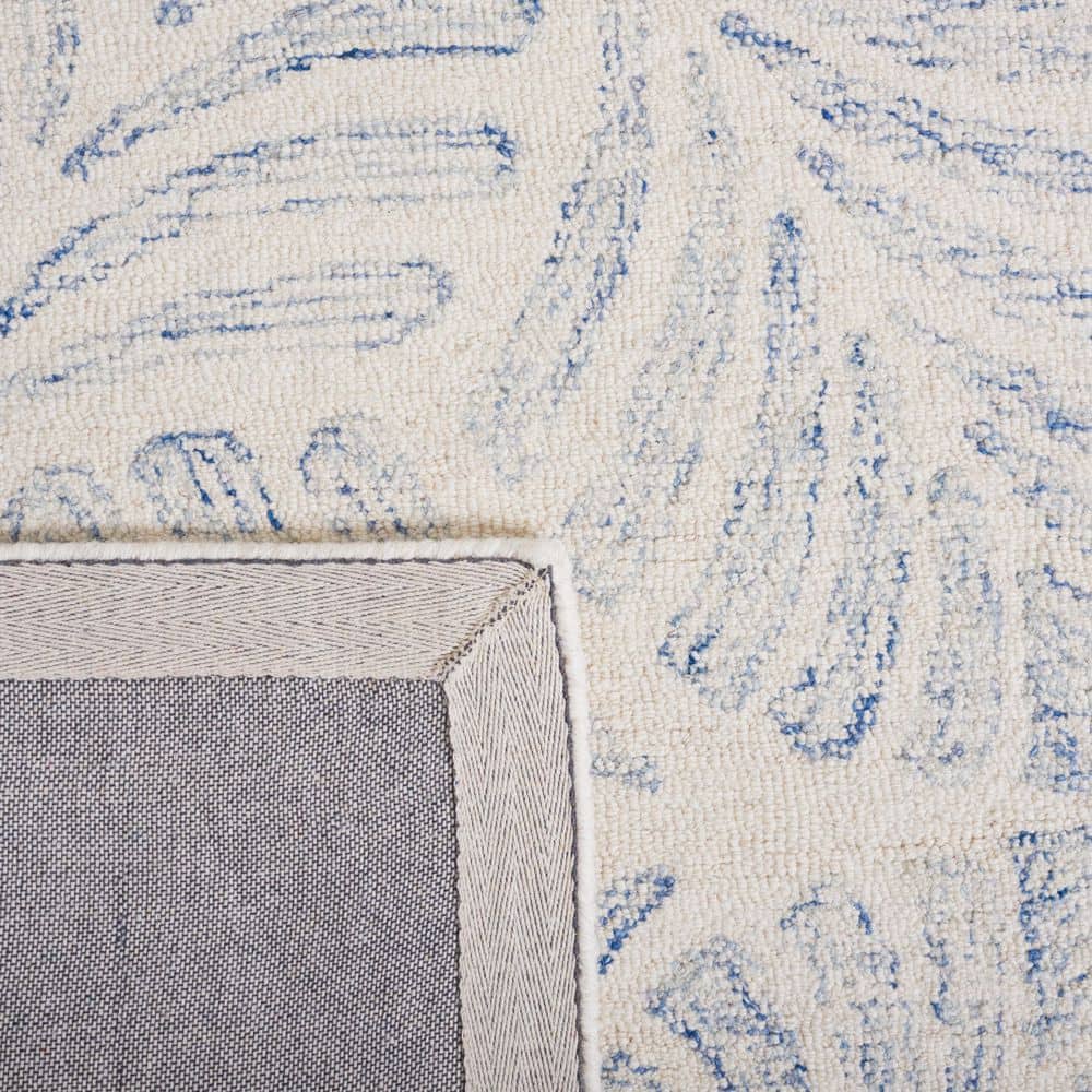 Ivory and Blue Handmade Wool Tufted 8' x 10' Area Rug