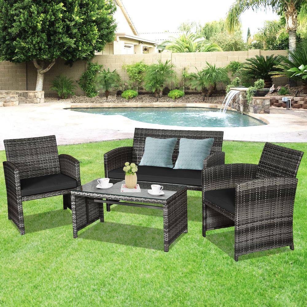 Black 4-Piece Rattan Patio Furniture Set with Glass Table