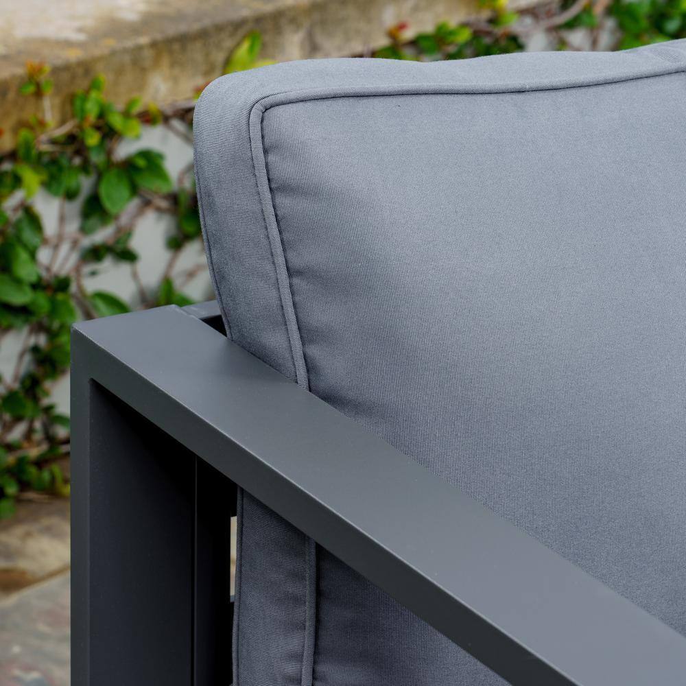 Close-up of the back cushion and armrest of a charcoal aluminum patio chair