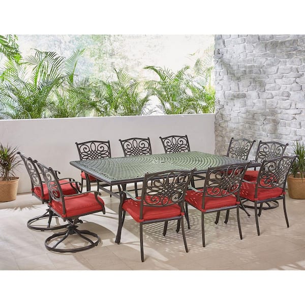 Hanover Traditions 11-Piece Aluminum Outdoor Dining Set with 4 Swivel Rockers and Red Cushions