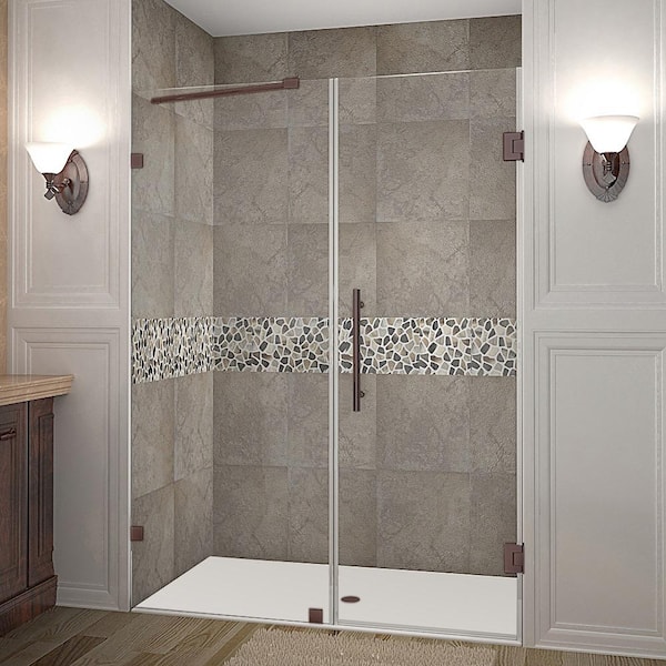 Aston Nautis 52.25 in. - 53.25 in. x 72 in. Frameless Hinged Shower Door in Bronze