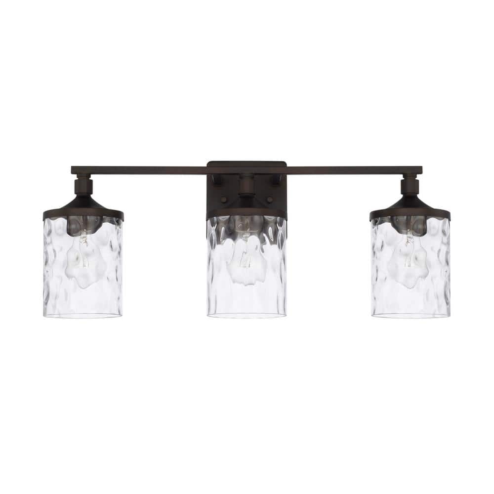 24 in. W x 10 in. H x 7 in. E 3-Light Clear Water Glass Vanity Light in Bronze price history on PriceWatchPro