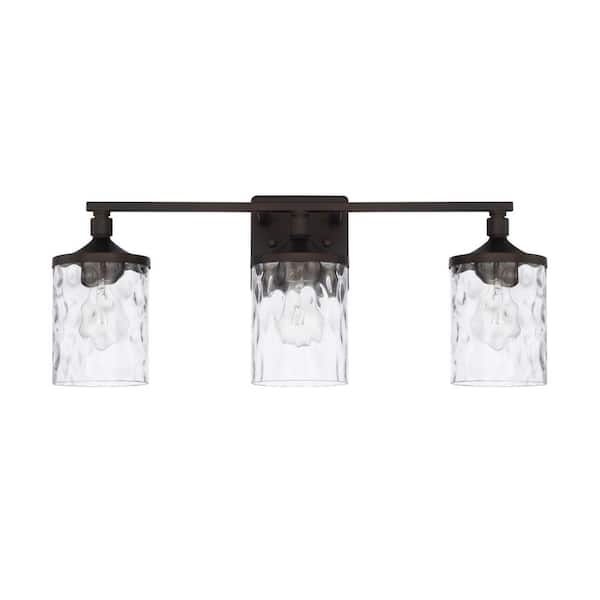 24 in. W x 10 in. H x 7 in. E 3-Light Clear Water Glass Vanity Light in Bronze