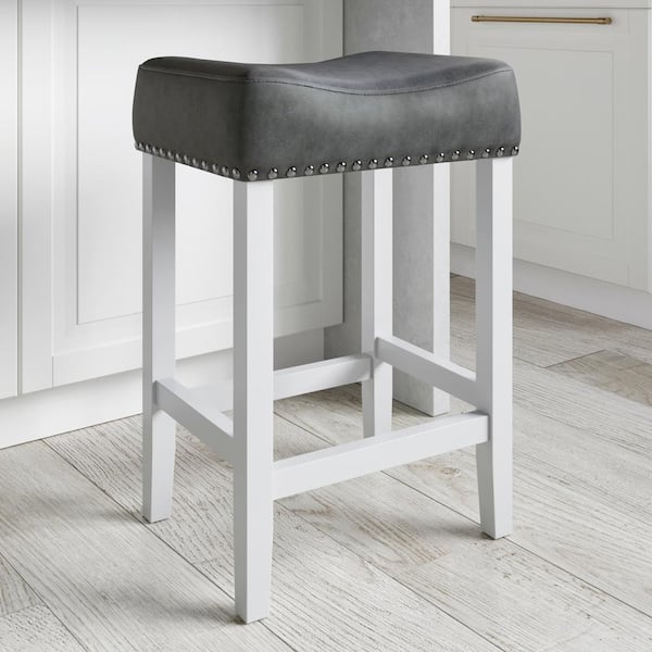 Nathan James Hylie 24 in. Dark Gray Faux Leather Nailhead Saddle Cushion White Wood Counter Height Bar Stool
