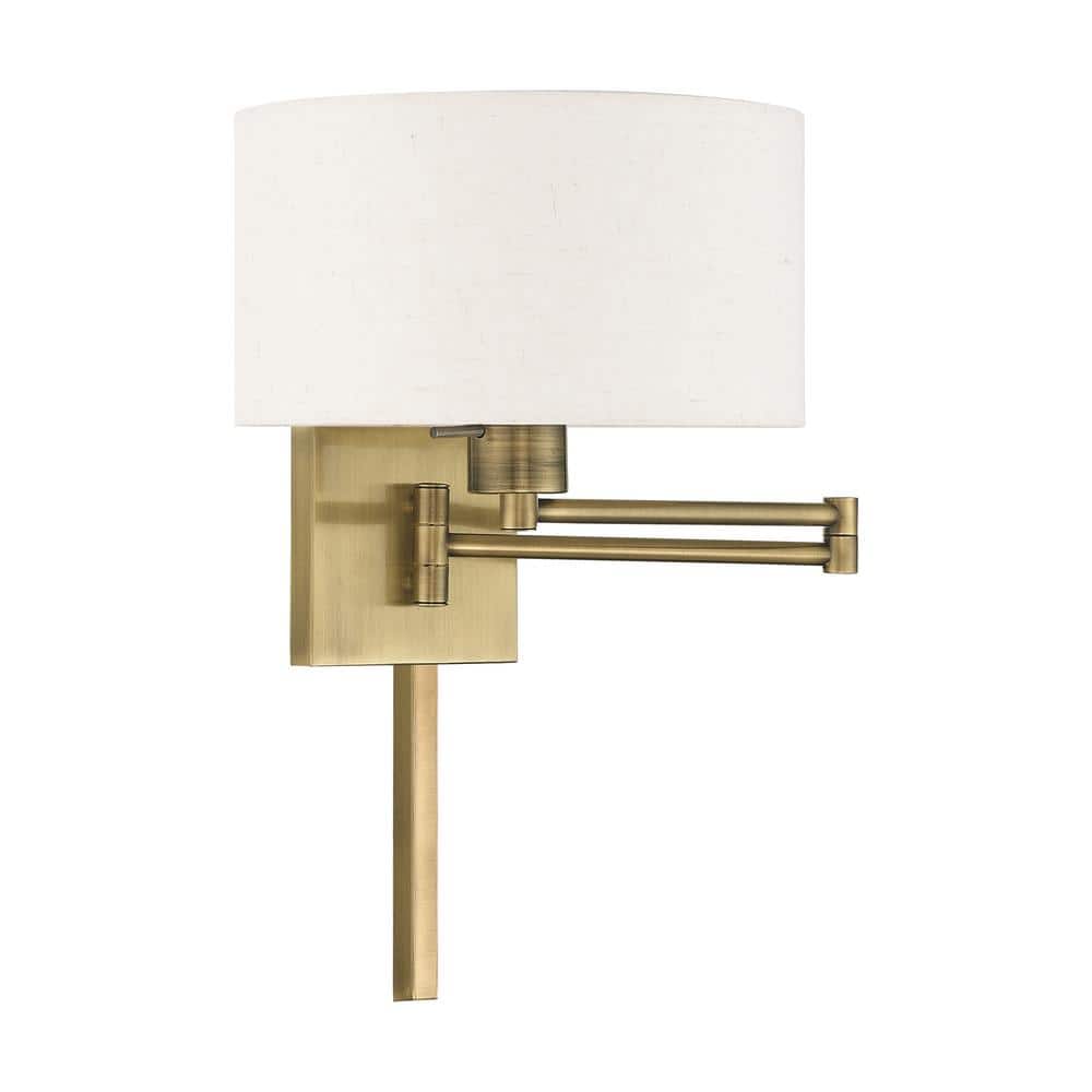 Antique Brass Swing Arm Wall Lamp with Oatmeal Shade