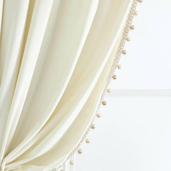 HOMEBOUTIQUE Luxury Vintage 42 in. W x 84 in. L Velvet with Silky Pompom Trim Light Filtering Window Curtain Panel in Ivory Single