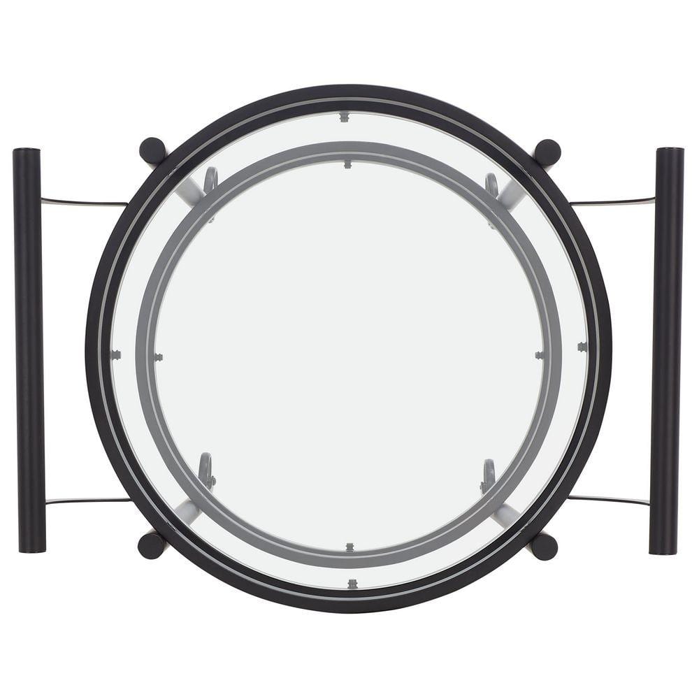 Top-down view of a round bar cart with matte black frame and glass shelf.