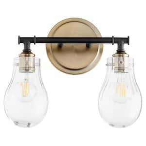 Dillinger Soft Contemporary 14 in. Width in. 2-Lights Black and Aged Brass Finish Vanity Light with Seeded Glass Shades.