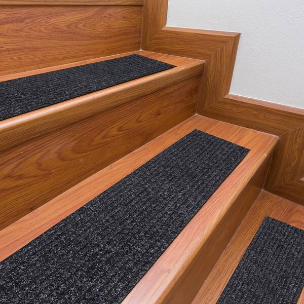 https://images.thdstatic.com/productImages/aab6784a-65c0-4c90-b02c-b7f08e32e99f/svn/black-black-ottomanson-stair-tread-covers-cst6008-14pack-31_600.jpg