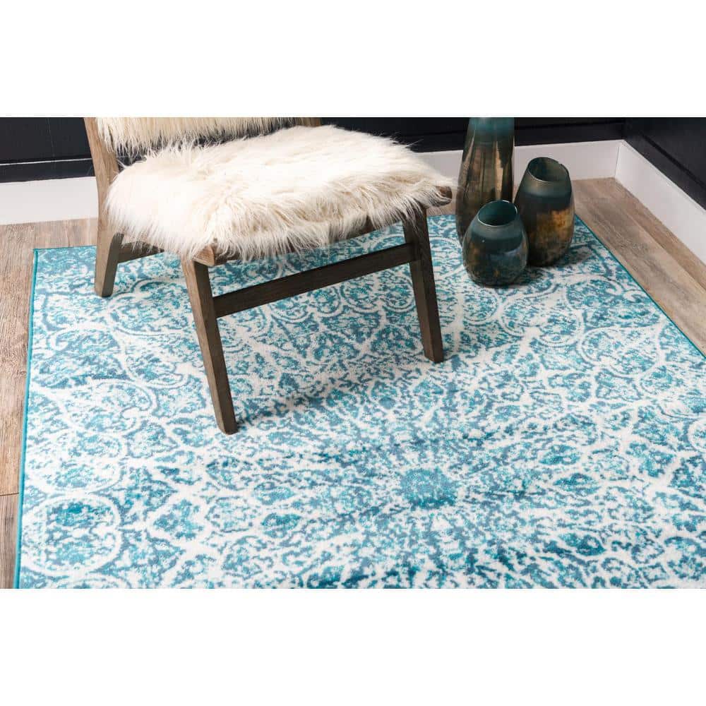 Turquoise and Ivory Geometric Synthetic Area Rug