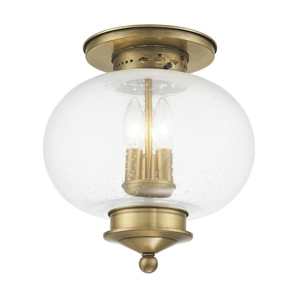 Harbor Antique Brass Globe LED Flush Mount with Hand Blown Seeded Glass