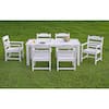 White 5-piece outdoor dining set arranged on a green lawn.