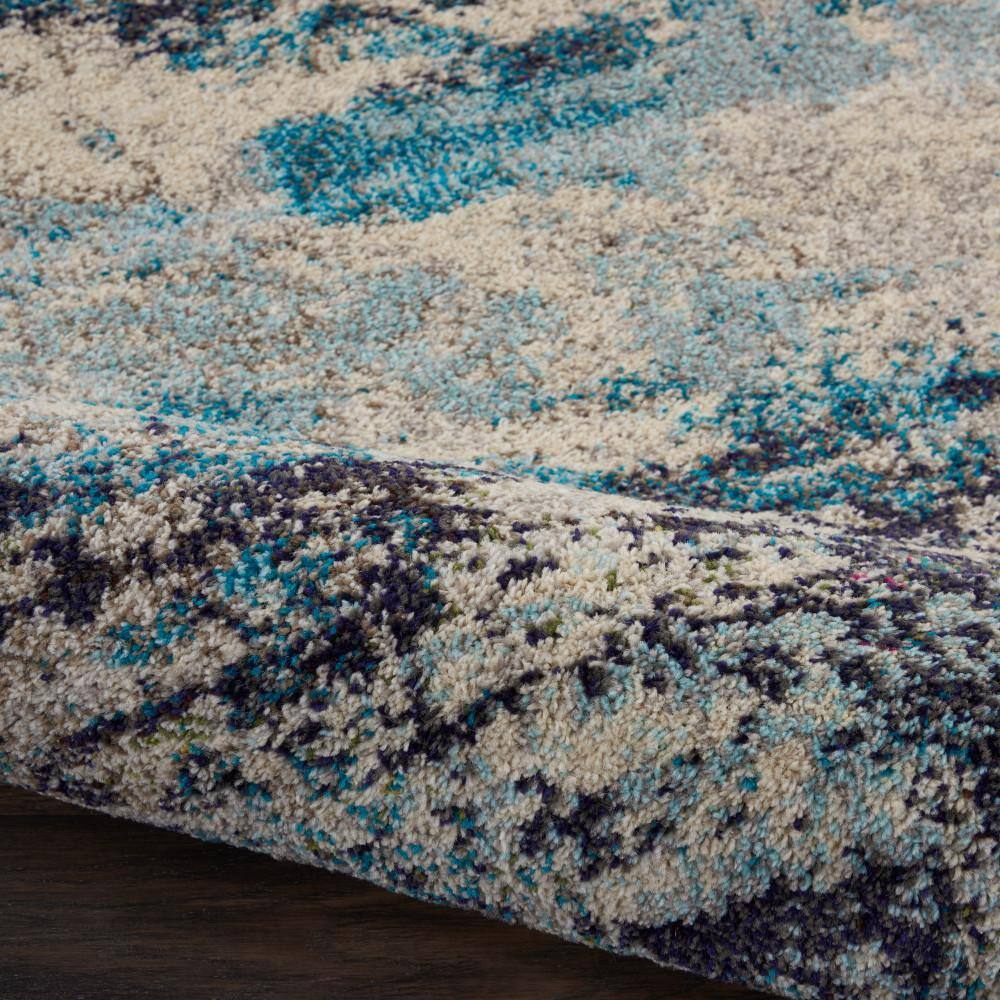 Ivory and Teal Blue Abstract 6' x 9' Synthetic Area Rug