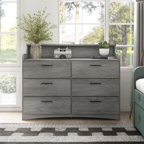 https://images.thdstatic.com/productImages/aaf78dc9-fa5a-4548-a811-97f17258a1c9/svn/vintage-gray-oak-furniture-of-america-dressers-ynj-2165c35-44_600.jpg