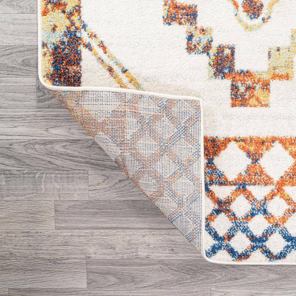 Ivory and Blue Geometric 8' x 10' Synthetic Area Rug