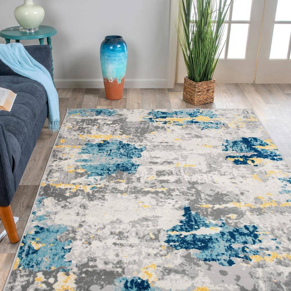 Cream and Blue Abstract Synthetic 5' x 7' Area Rug