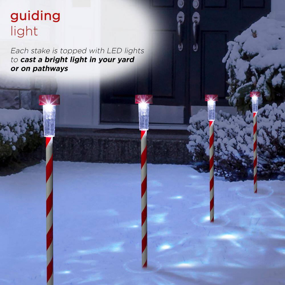 Alpine Corporation 27" Striped Plastic Solar Light-Up Holiday Garden Stakes, Set of 4, Red/White