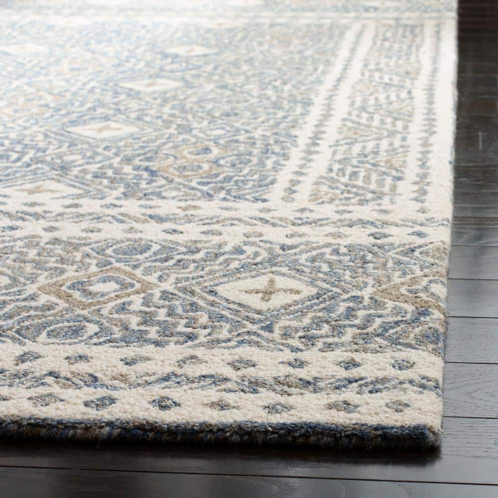 Ivory and Blue Handmade Wool Tufted Area Rug, 5' x 8'
