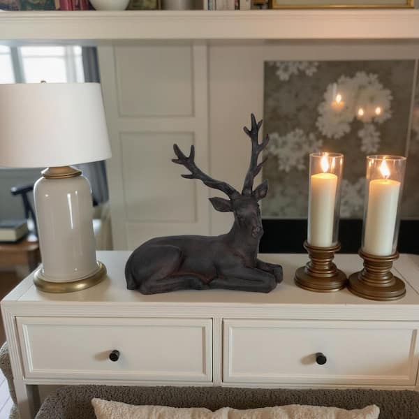 Liv & Skye Brown 13 in. x 13 in. Resin Sitting Deer Figurine